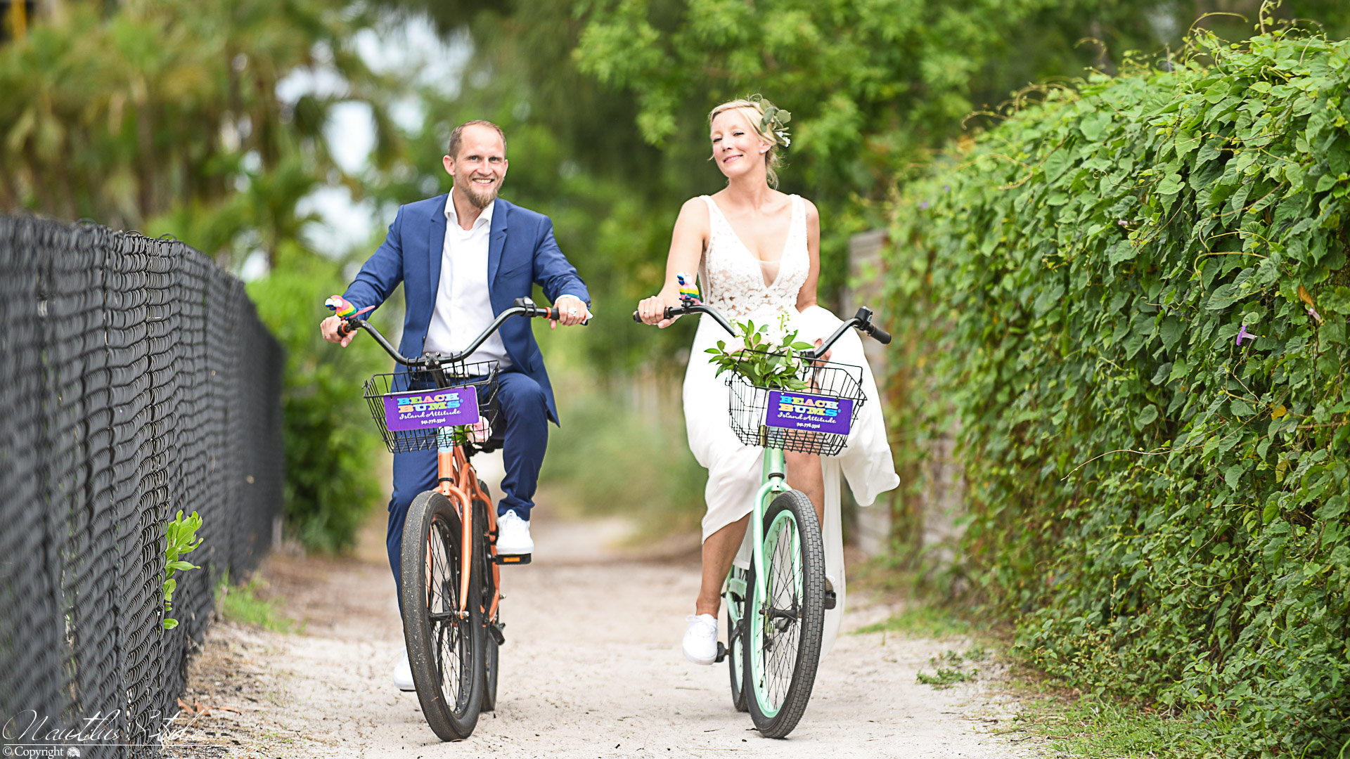Photo showing bride and groom on a bicycle
