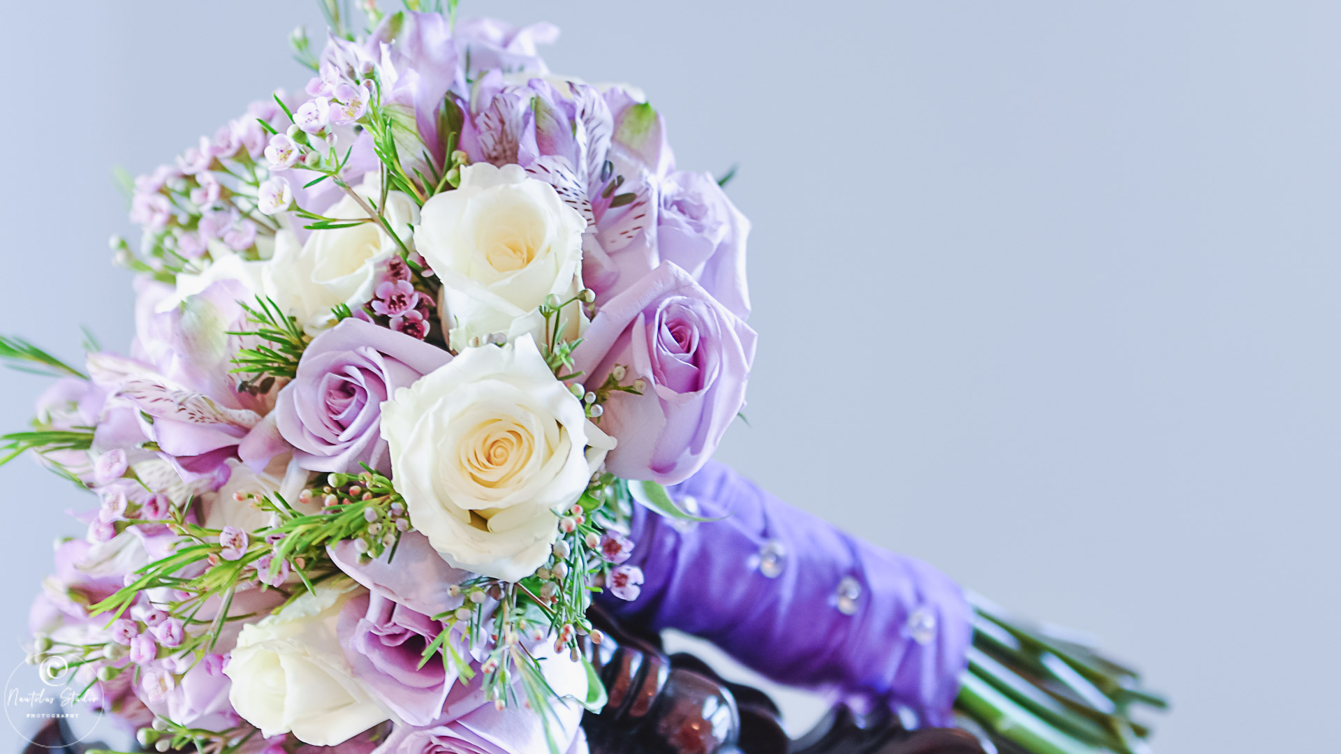 Photo showing bridal bouquet in light lavender and creme roses