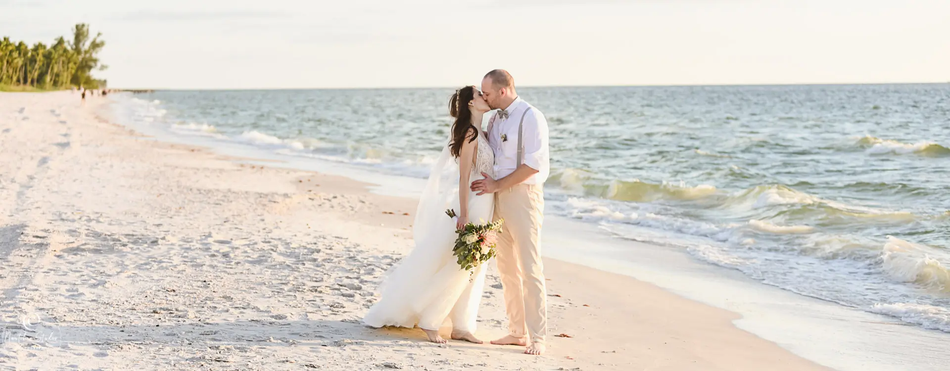 Naples beach wedding couple kissing