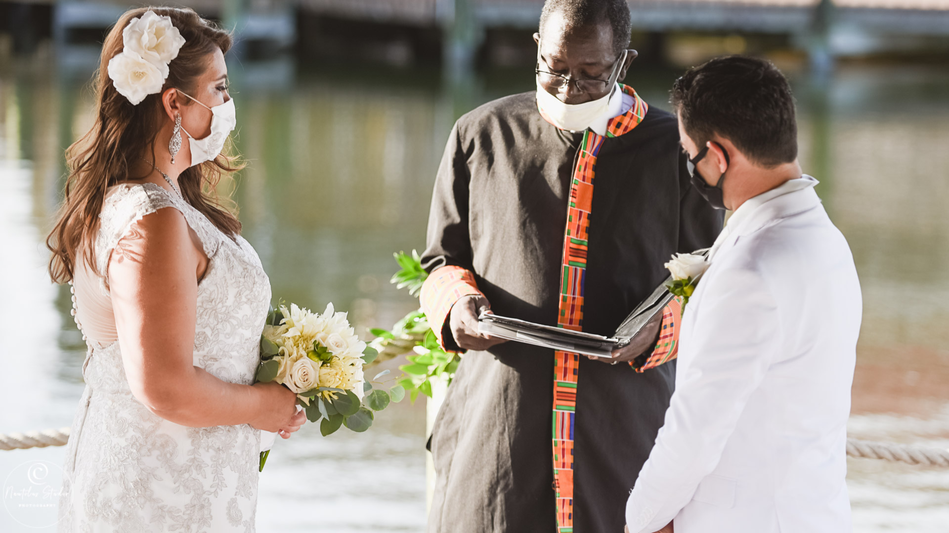 Wedding during covid 19 in Florida photo showing minister and bride and groom wearing facemask