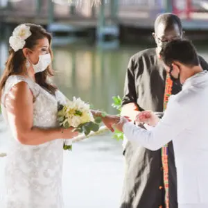 wedding during covid 19 in Florida showing bride and groom exchanging rings