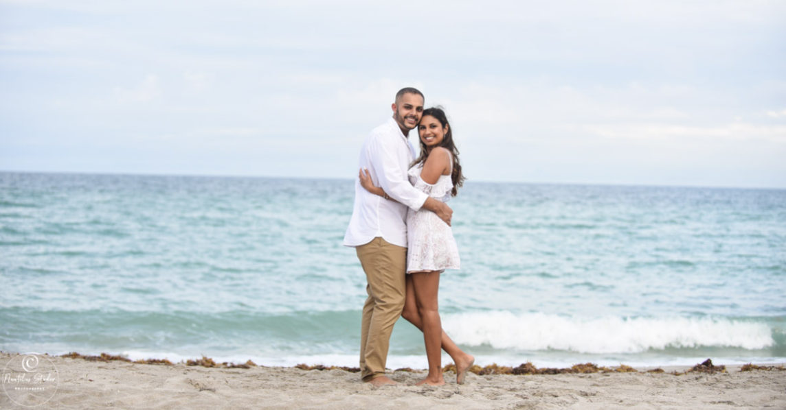 Marriage proposal photo showing couple on the beach