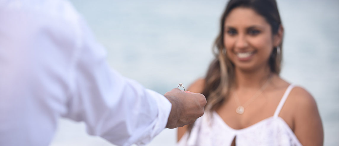 Beach wedding proposal in Fort Lauderdale showing ring to future bride