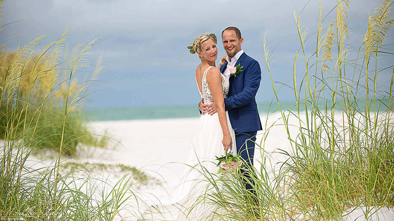 Anna Maria Island wedding, showing couple holding each other on the beach