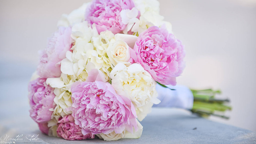 Photo of floral design bridal bouquet with peonies