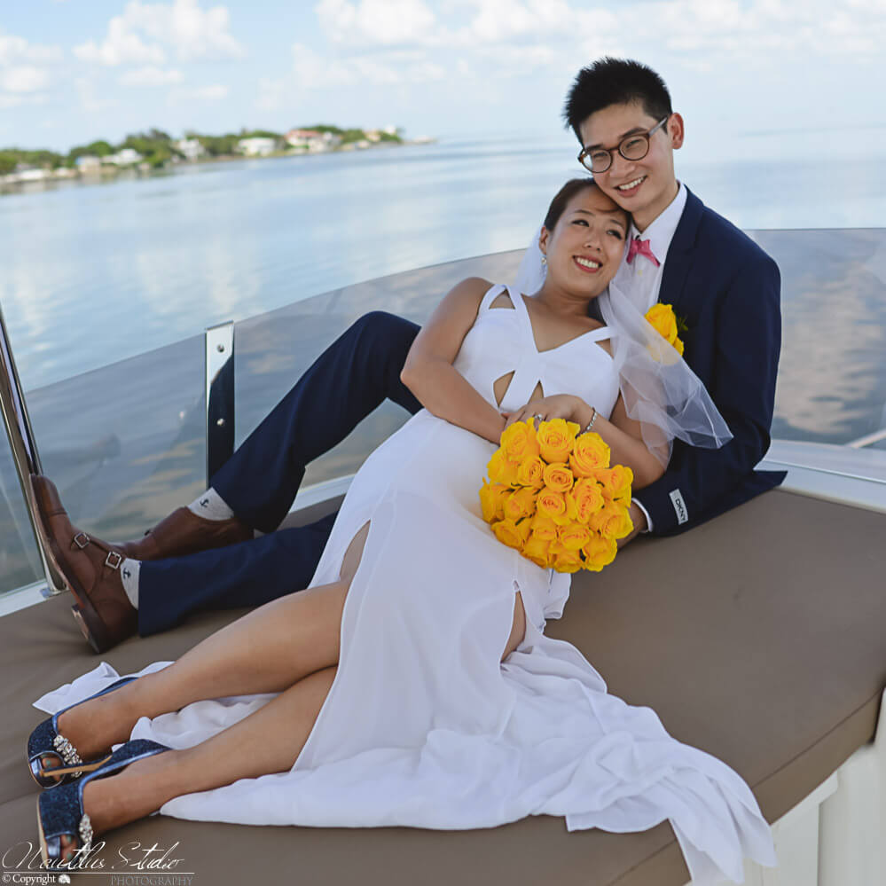Photo showing wedding couple relaxing after their Florida yacht wedding