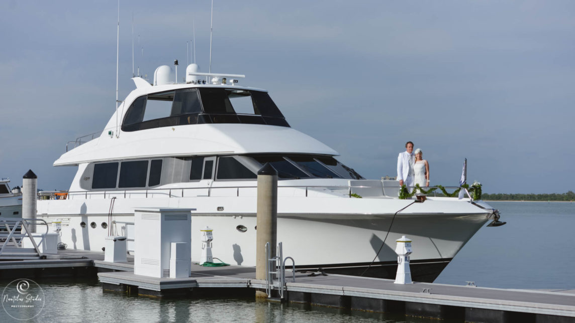 Wedding on the water photo showing wedding couple on their luxury yacht