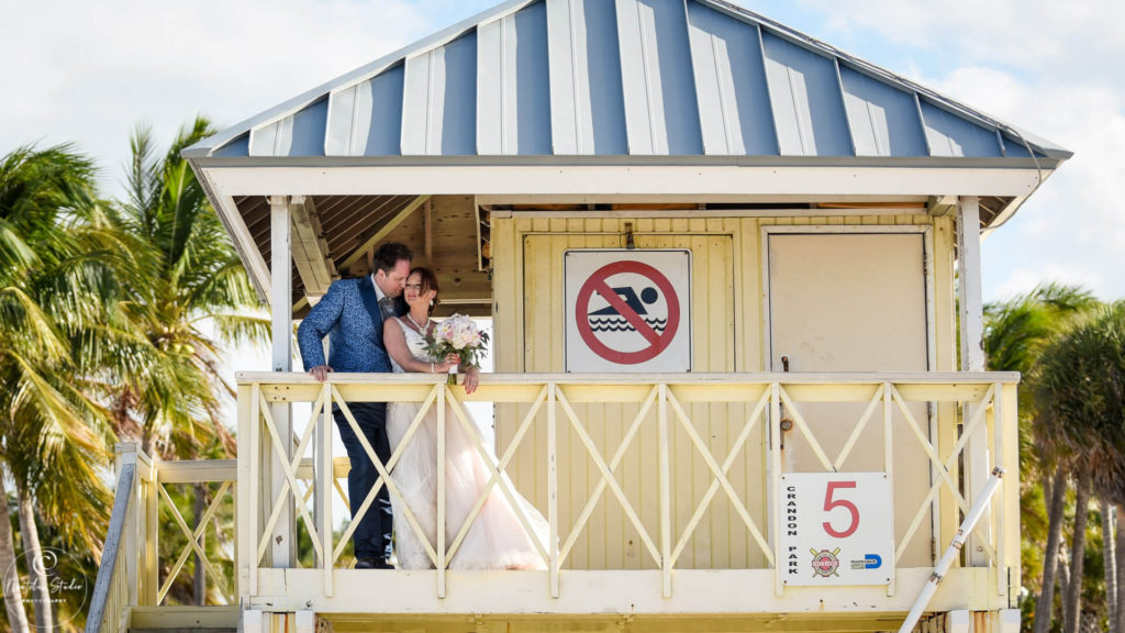 Photo of Key Biscayne beach wedding couple in the lifeguard tower