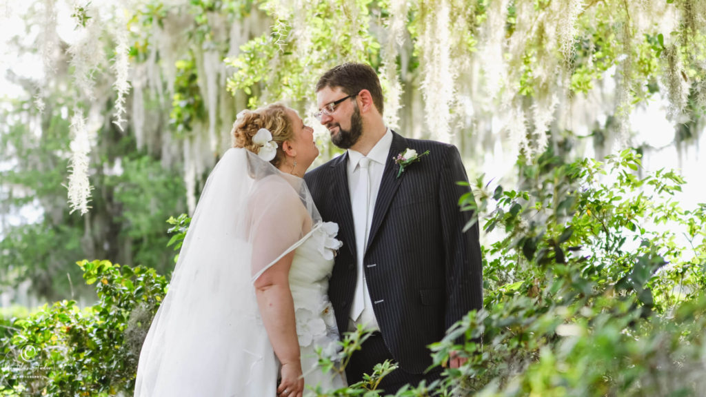 Orlando wedding photo of bride and groom under trees at Cypress Grove Estate