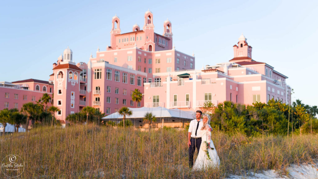 Photo of wedding couple in front of the Don Cesar Hotel in St. Pete Beach