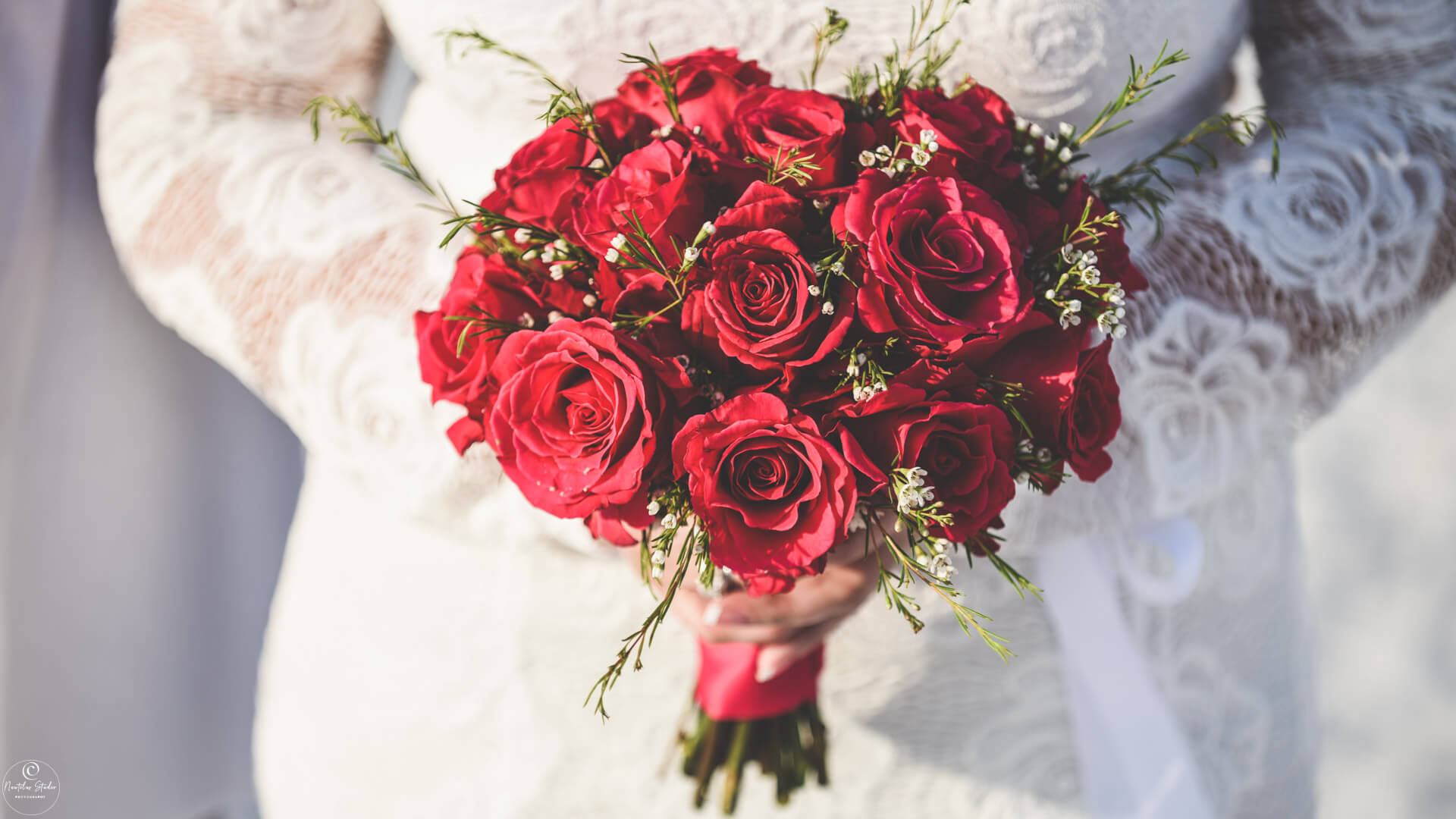 Photo of red rose bridal bouquet at a elopement wedding