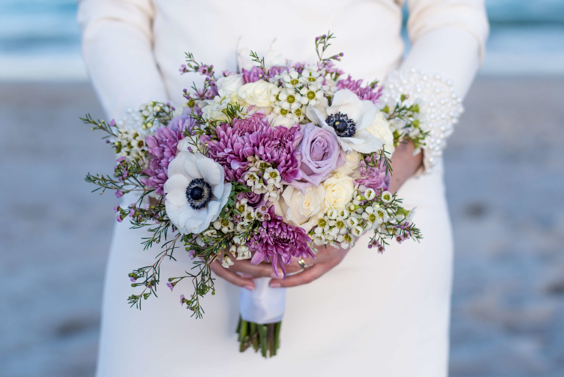 Photo of lavender bridal bouquet with white anemone