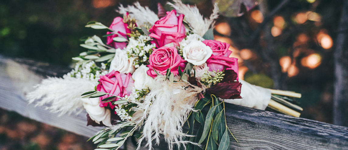 Bohemian bridal bouquet with hot pink roses and pampas grass