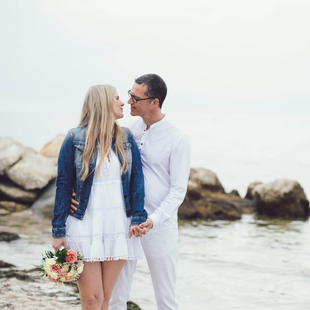 Simplicity minimalist elopement package and elopement, photo showing bride and groom at rocks
