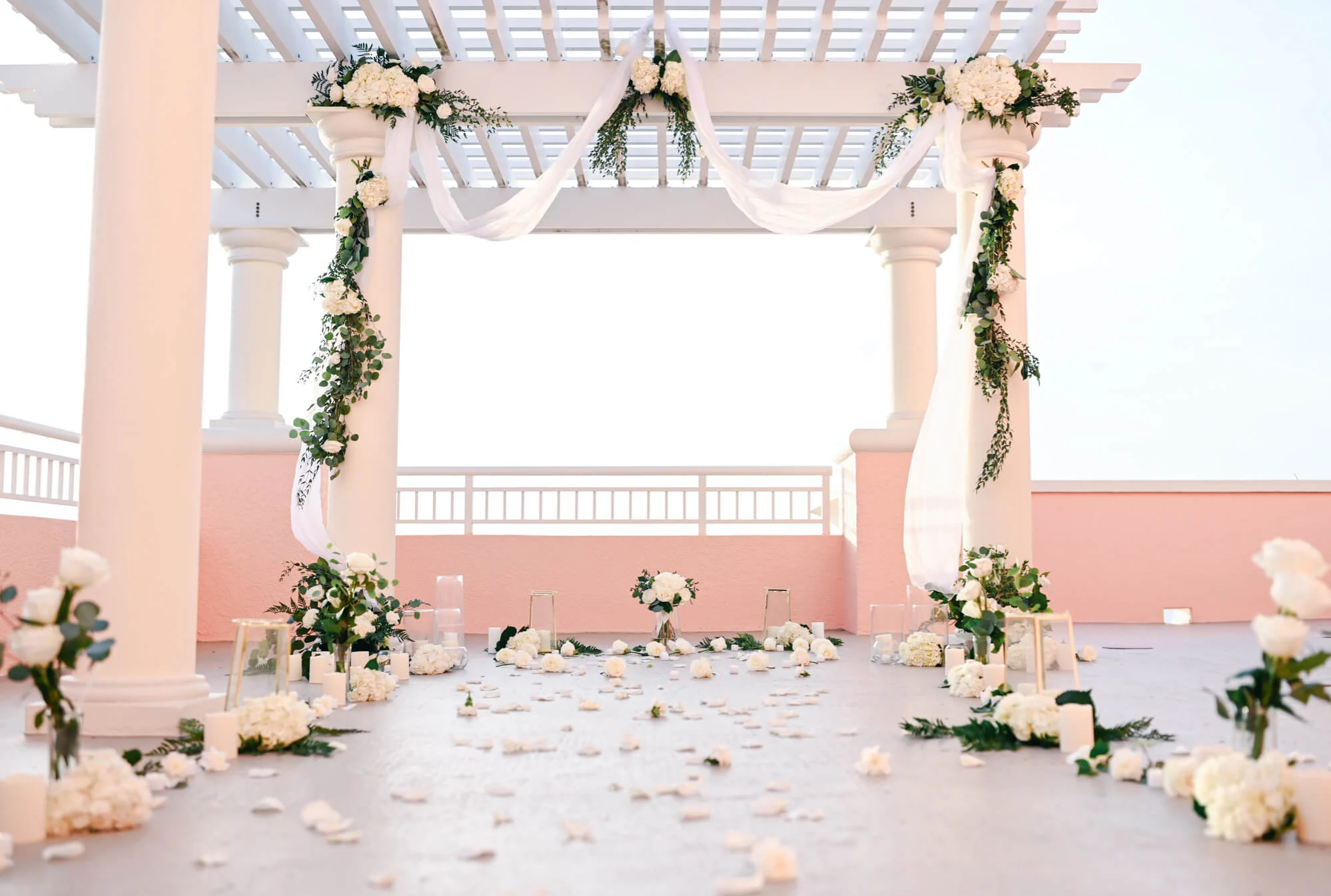 Photo showing marriage proposal decoration with white roses and flowers, golden lanterns. Private rooftop proposal at the Hyatt Regency on Clearwater Beach.